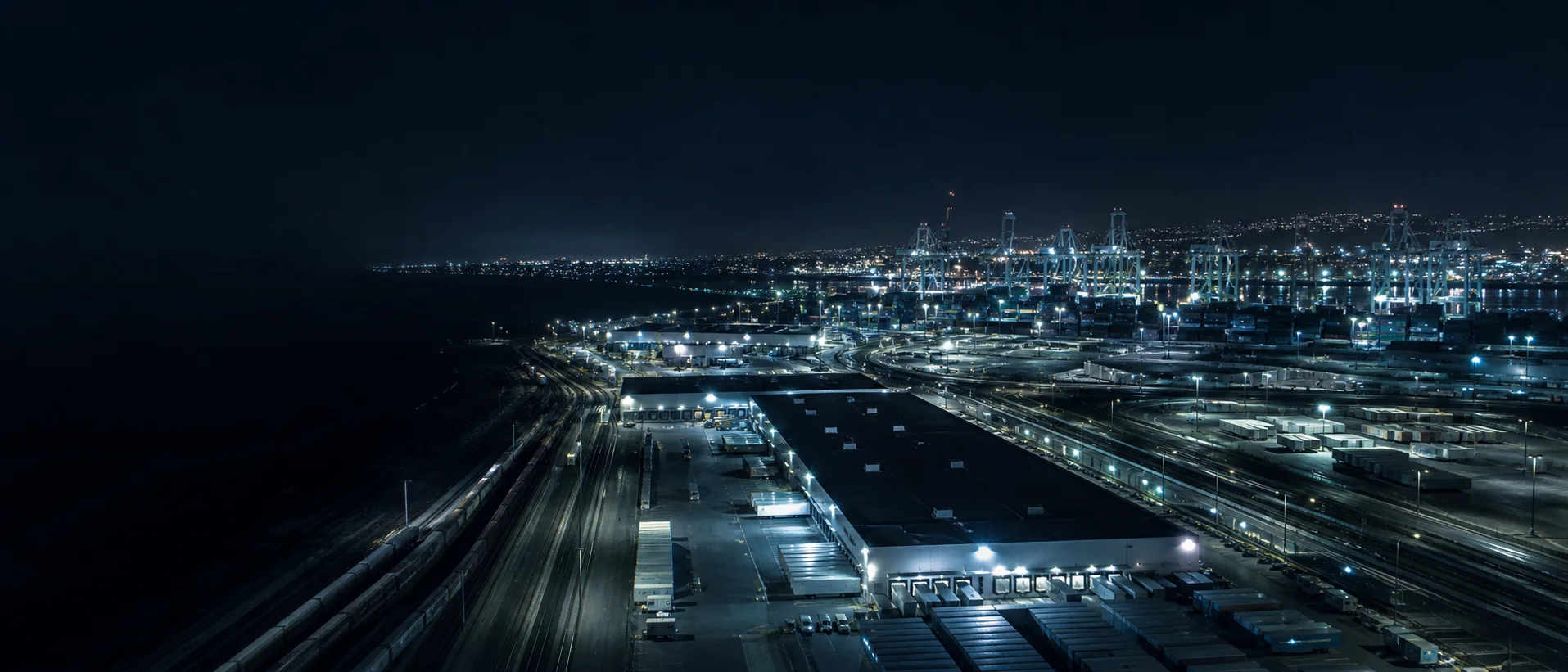 Port, rail, warehouse, and distribution operations at night